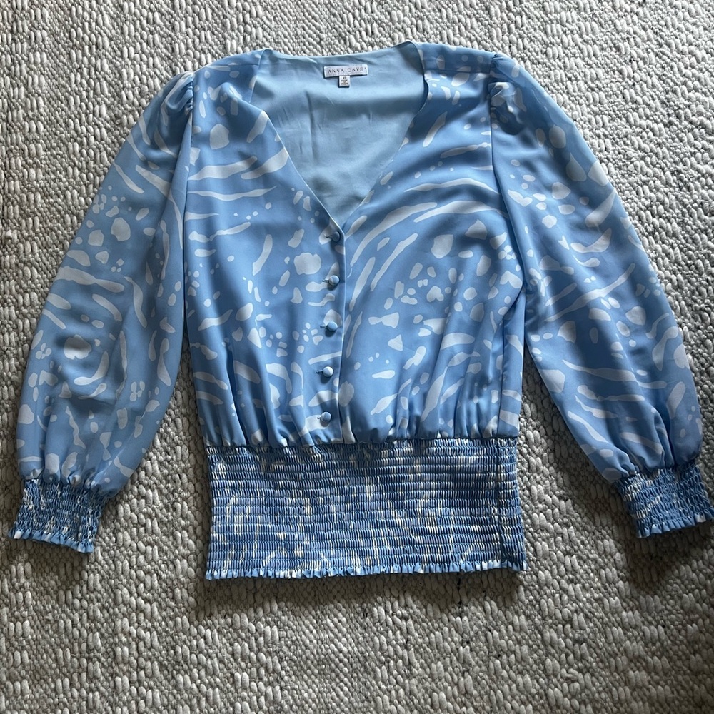 Light blue Anna Cate blouse with smocking and pinched shoulder detailing